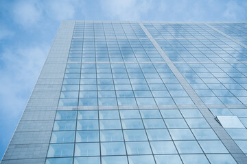 Obraz premium Looking up to high-rise office buildings, skyscrapers, architectures in financial district. Smart urban city for business and technology concept background