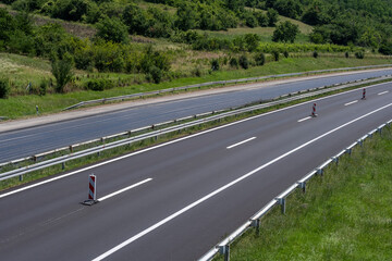 Empty open highway through pastoral landscape