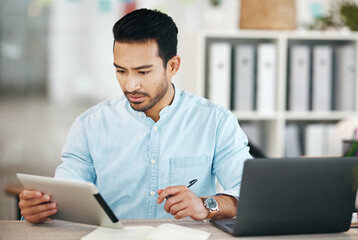 Creative asian man, tablet and writing schedule for planning, strategy or record keeping by laptop...