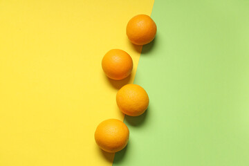 Composition with tasty oranges on color background