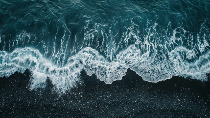 Aerial Drone View of a Beautiful Clear Sea: Waves and Foam on Dark Sand Beach