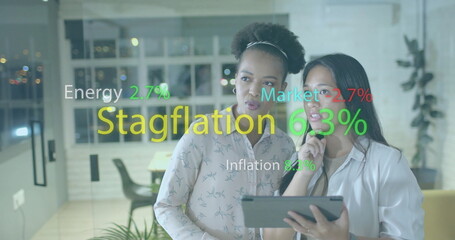 Image of financial data processing over diverse businesswomen in office