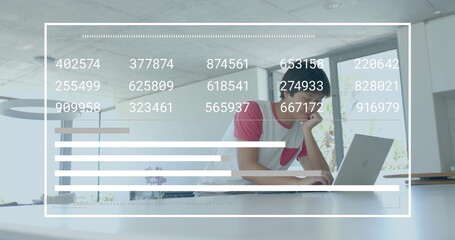 Image of financial data processing over asian businessman in office