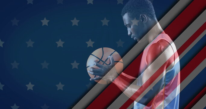 Image of flag of usa over biracial male basketball player