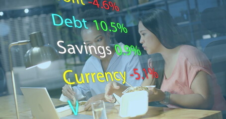 Image of financial data processing over diverse african american businesswomen in office