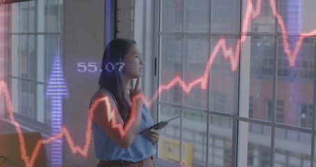 Image of financial data processing over biracial businesswoman in office