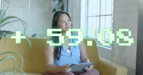 Image of financial data processing over biracial businesswoman in office