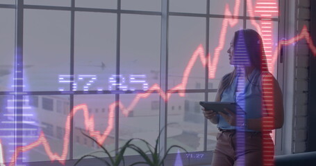 Image of financial data processing over biracial businesswoman in office