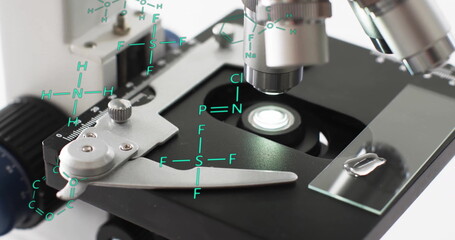 Image of scientific data processing over microscope in laboratory