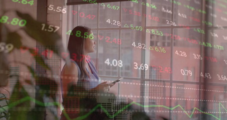 Image of financial data processing over biracial businesswoman in office