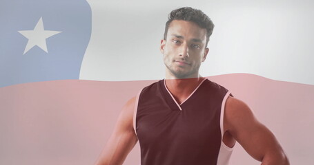 Image of flag of chile over biracial male volleyball player