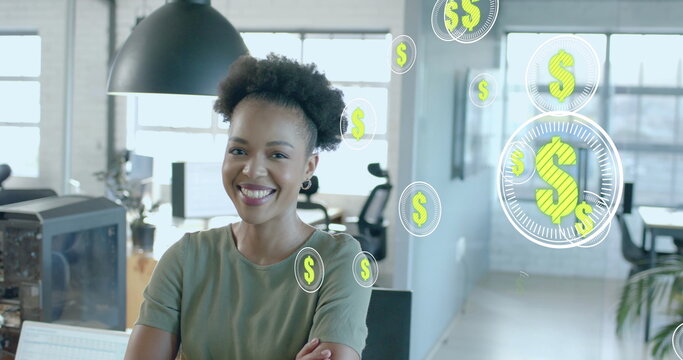 Image of dollar signs data processing over african american businesswoman in office