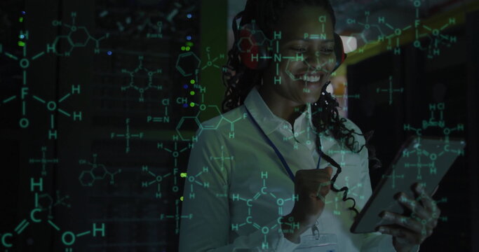 Image of scientific data processing over african american female it technician by servers