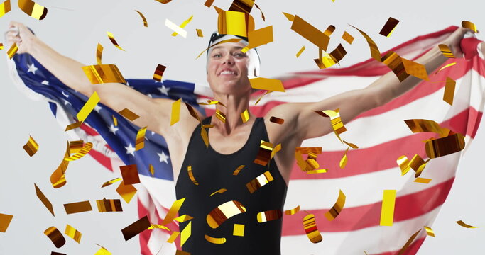 Image of confetti over caucasian female swimmer holding flag of usa - Powered by Adobe