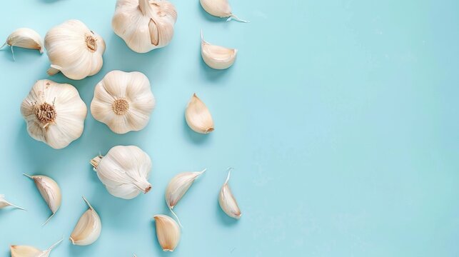 Garlic Bulb and Cloves on Blue Background Vegan Organic Nutritious Natural Health Benefits of Allicin