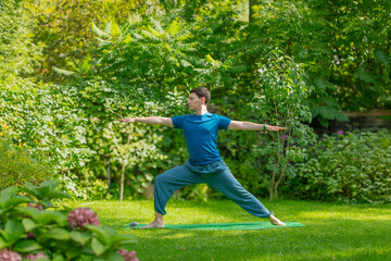 man doing yoga in nature