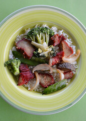 Chinese style BBQ pork with vegetables and long grain rice.