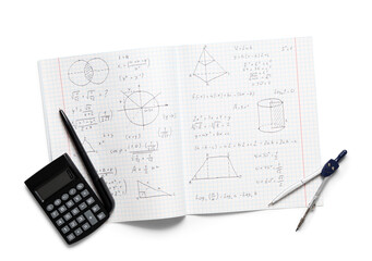 Copybook with handwritten maths formulas, calculator, pencil and pair of compasses isolated on white background