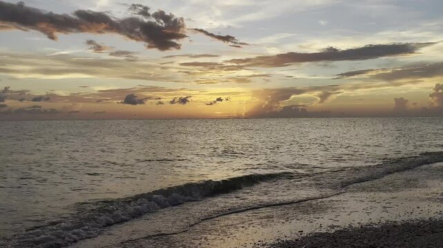 Peaceful sunset sea beach waves 
