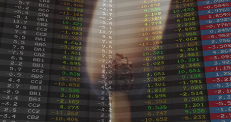 Image of financial data processing over lit match