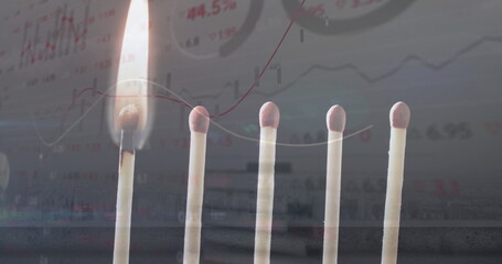 Image of financial data processing over lit match