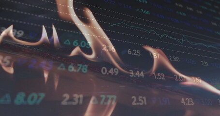 Image of financial data processing over flames
