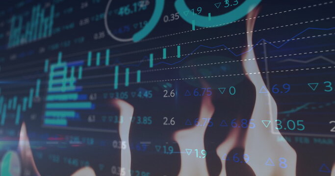 Image of flames over diagrams and data processing