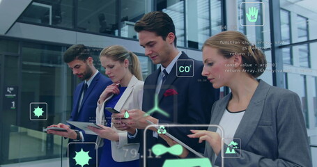 Image of ecology icons over caucasian colleagues using tablet in office