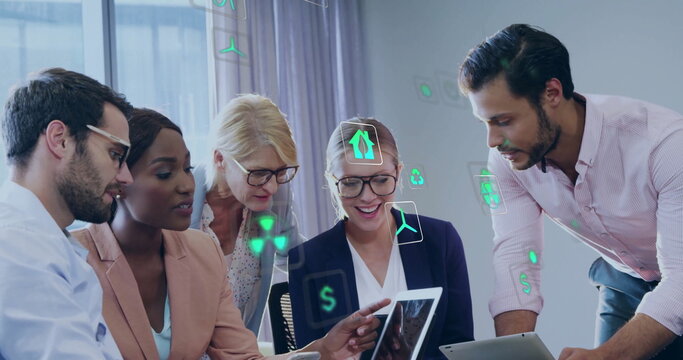 Image of ecology icons over diverse colleagues using technology in office - Powered by Adobe