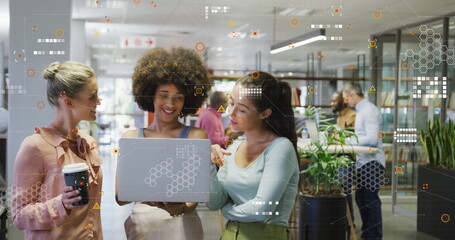 Image of processing data over happy diverse female colleagues using laptop at casual office