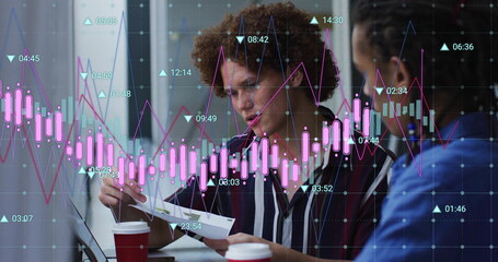 Image of graph processing data over diverse male colleagues talking at casual office