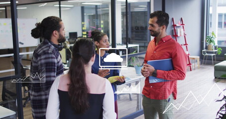 Image of media icons processing over diverse colleagues discussing at casual office