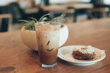 Local coffee shop photography captured on Nikon FE film camera, picturing iced latte and hot latte