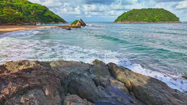A white wave hits the rock in slow motion.
turquoise sea around Ya Nui beach.
Ya Nui beach is the good place for swimming snorkeling and sea canoe. Separated sea During low tide. white foam splashing