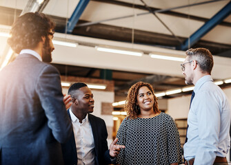 Team, chat and meeting in office cafeteria with diversity, casual conversation and brainstorming ideas. People, male leader and social in workplace for inspiration, motivation and pep talk in morning