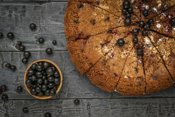 Homemade Berry Cake with Fresh Blackcurrants on Rustic Wooden Table