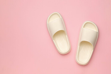 Minimalist White Slip-on Sandals on Pink Background Summer Footwear Fashion Concept