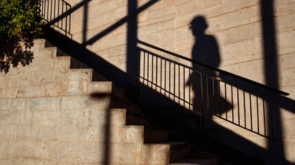 silhouette of person climbing steps