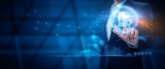 Insurance concept. A businessman holding and giving insurance and assurance icons, including Insurance, health, money, and Insurtech concepts, on a virtual screen.