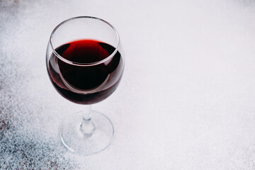 A glass of red wine, close-up. Copy space.
