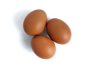 Brown chicken eggs isolated against white background
