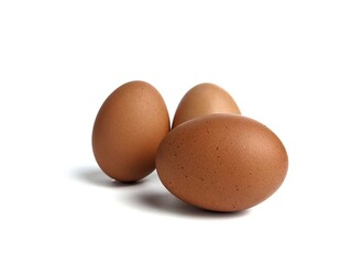Brown chicken eggs isolated against white background