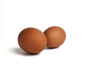 Brown chicken eggs isolated against white background