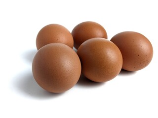 Brown chicken eggs isolated against white background