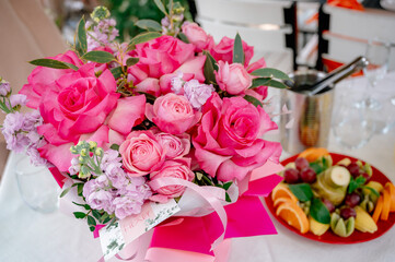 Fresh pink rose flowers bouquet in a natural soft light tone and copy space with selective focus.