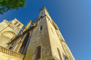 Cathedral Saint-Nazaire-A river runs through a town with a castle in the background