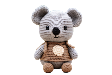 A Crocheted Grey Mouse Plush Toy Wearing a Brown Vest With a White Dot on a Clear PNG or White Background.