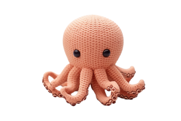 A Plush Coral Octopus With Big Eyes Rests On A White Surface on a Clear PNG or White Background.