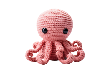 A Pink Crocheted Octopus Toy With Big Eyes Smiles for the Camera on a Clear PNG or White Background.