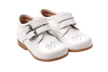 A Pair of White Leather Shoes With Buckles and Perforated Detail for a Tiny Tot on a Clear PNG or White Background.